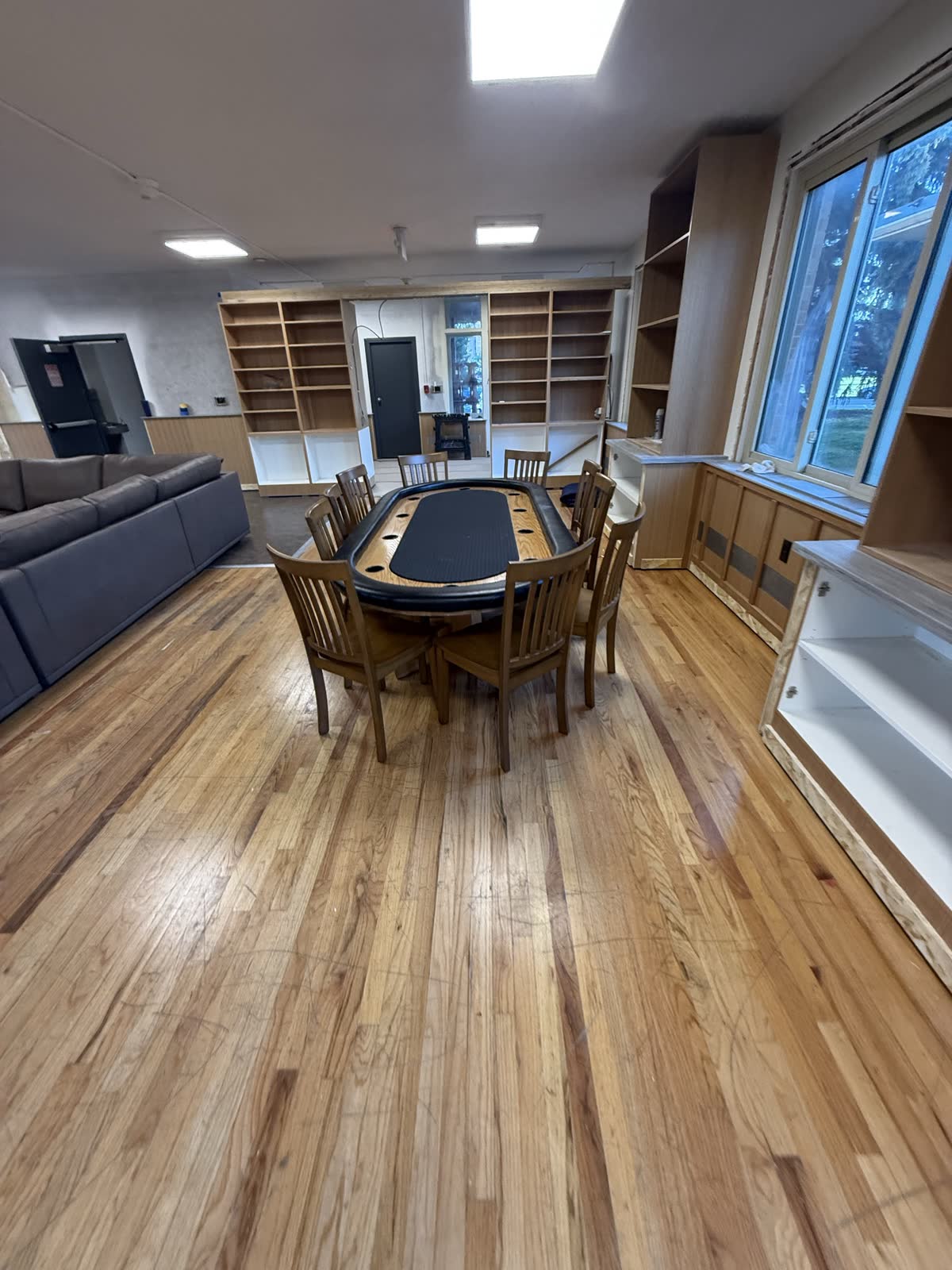 Poker table and built-in bookshelves, August 21 2026