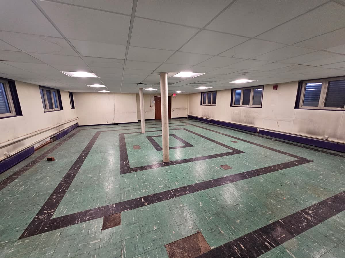 Chapter room showing original green and black VCT tile floor