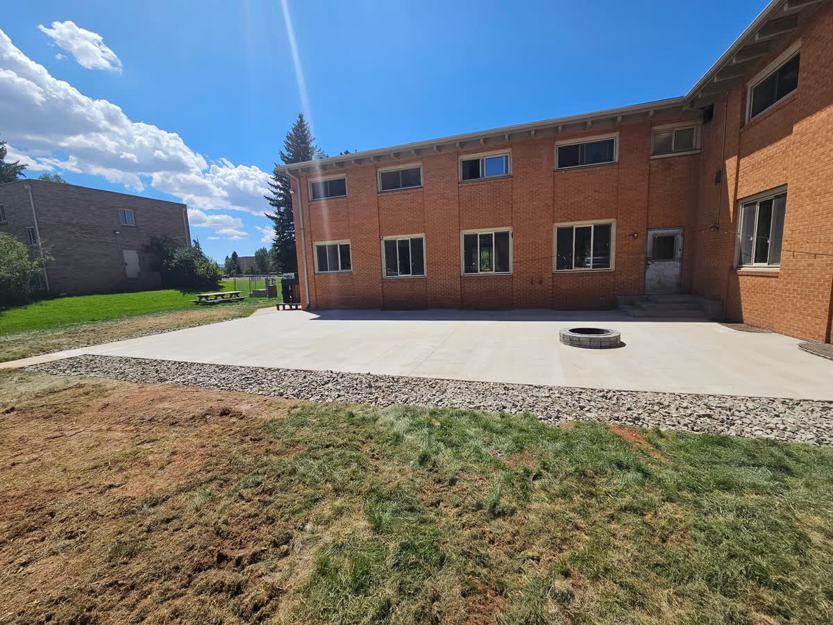 Rear patio cured with gravel border, July 20 2026