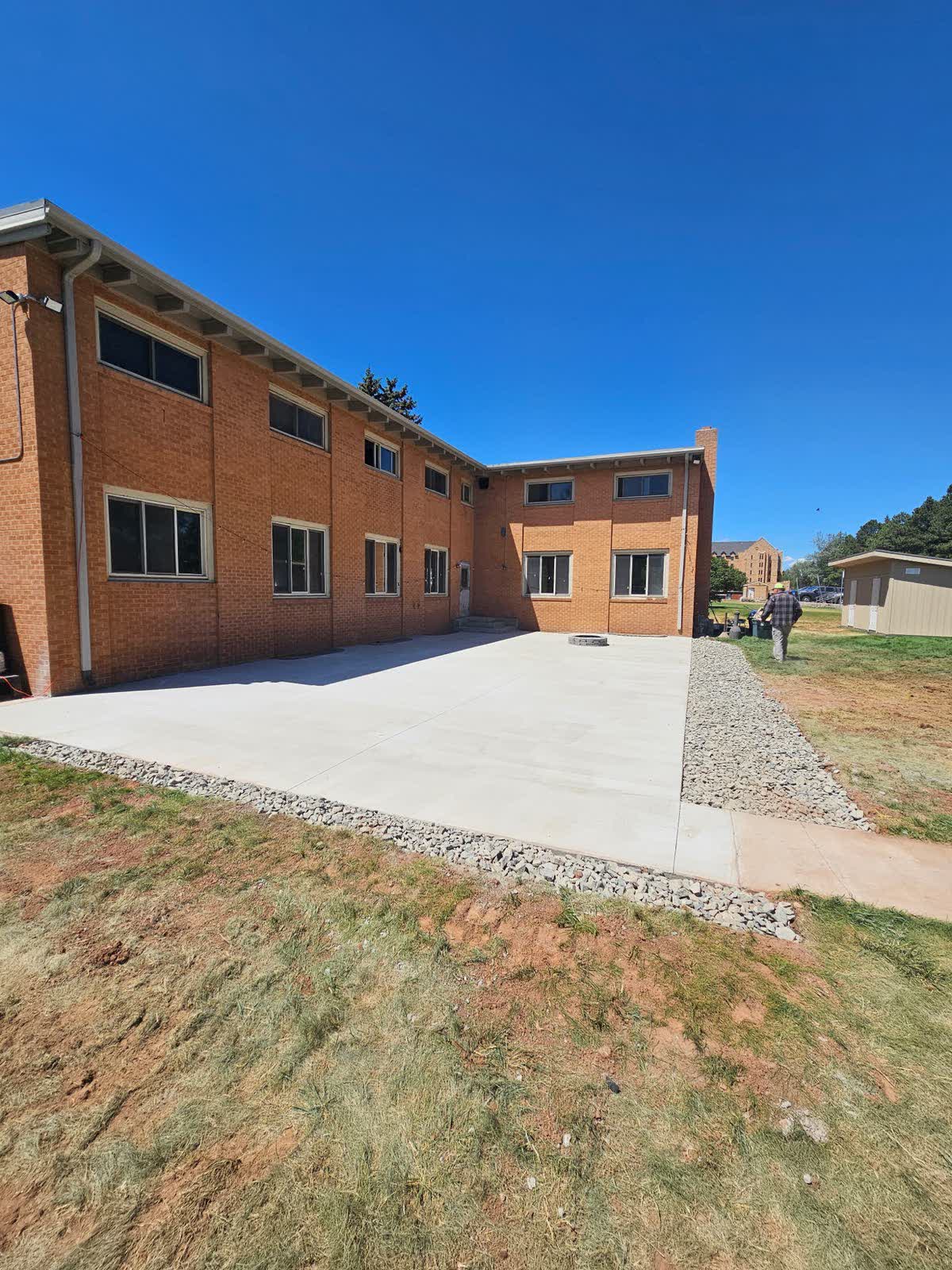 Wide view of rear patio with shed, July 20 2026